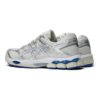 Uptown Asics GEL CUMULUS 16 running shoe in cream and illusion blue with metallic silver synthetic overlays.